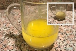 Glass mug with lemon-butter sauce inside, inset photo of the same with pepper as well