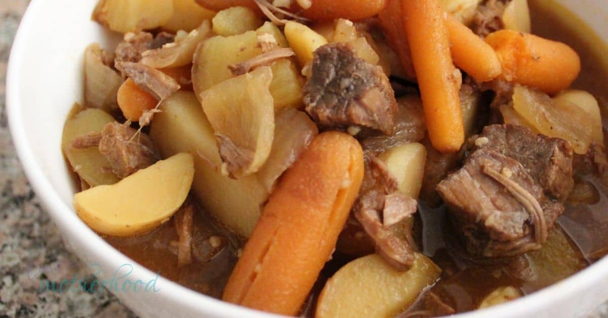 Image of finished easy slow cooker beef stew in a white bowl