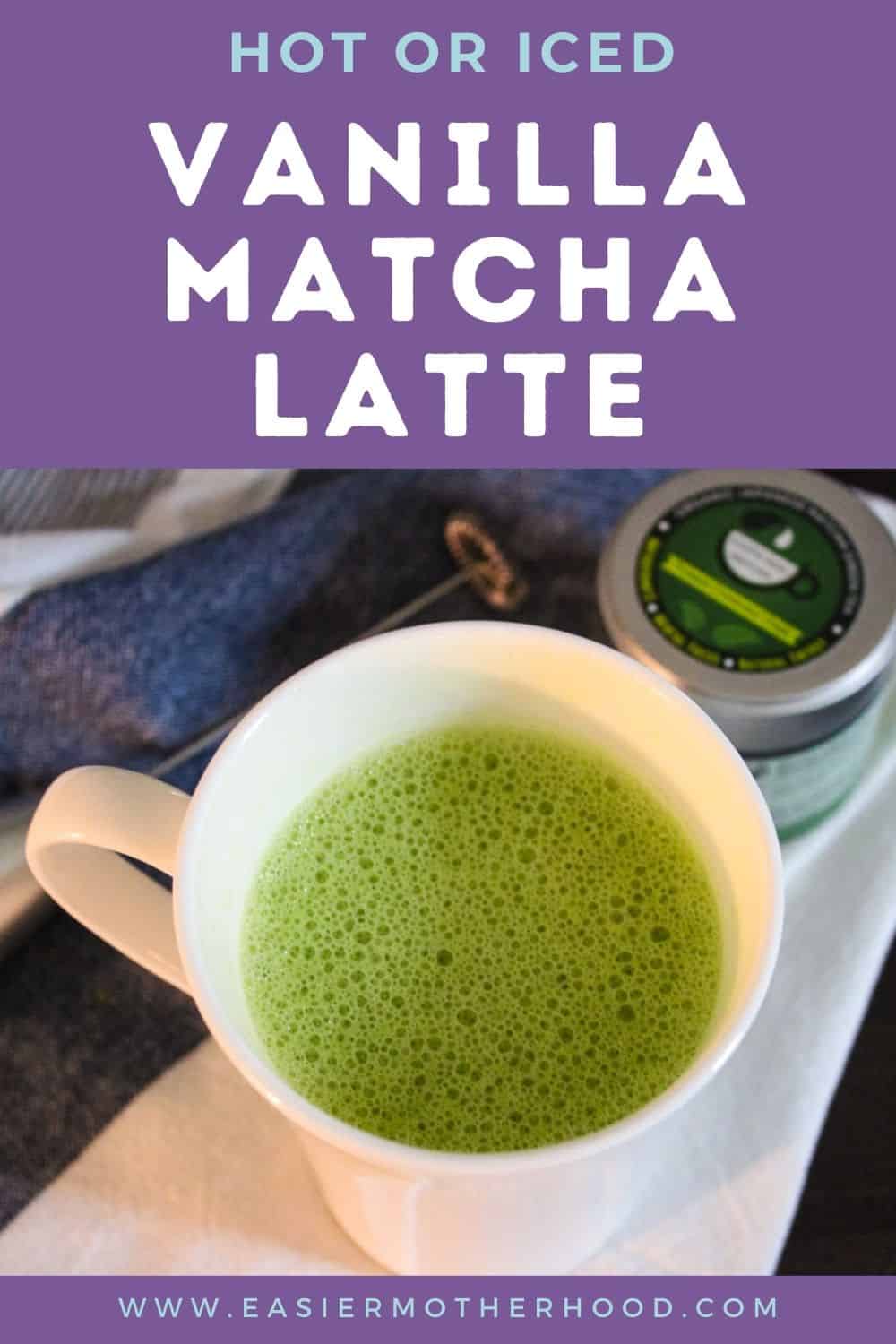 White mug with vanilla matcha latte, matcha powder, and frother on blue and white towel 