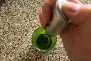 Mixing and frothing matcha powder in hot water