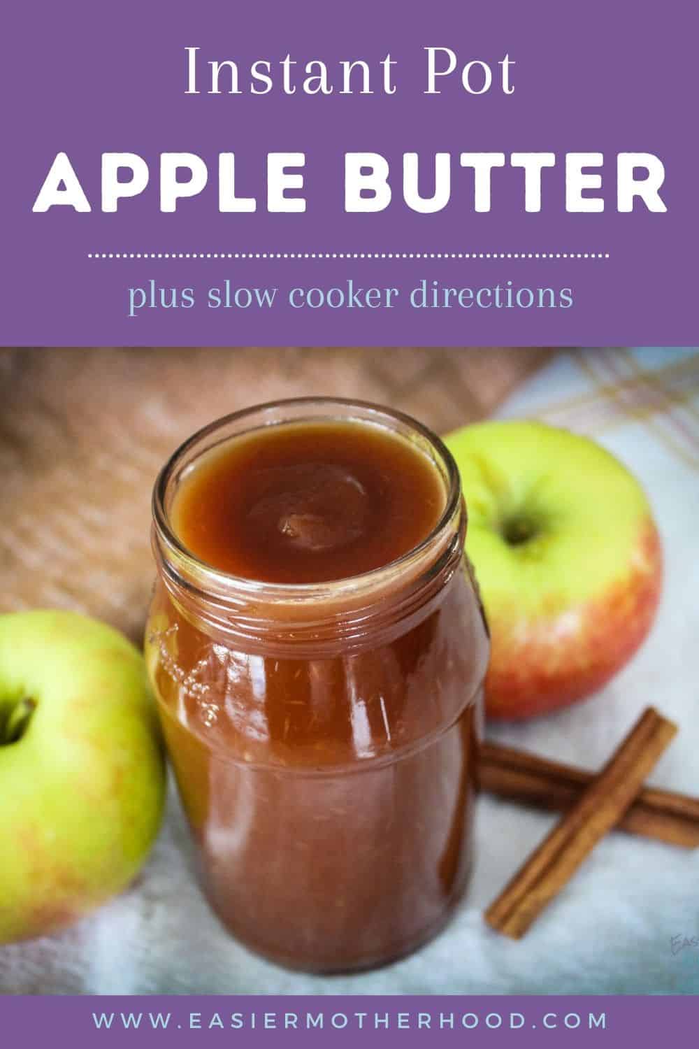 A jar of apple butter, apples, and cinnamon sticks