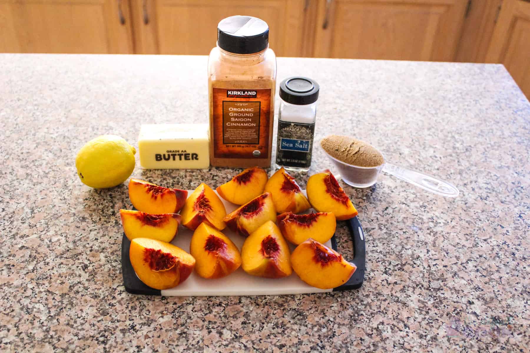 Ingredients for caramelized peaches on kitchen counter.