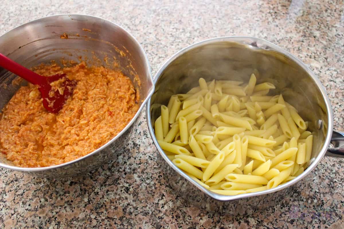 Sauce in one bowl and piping hot pasta ready to mix in