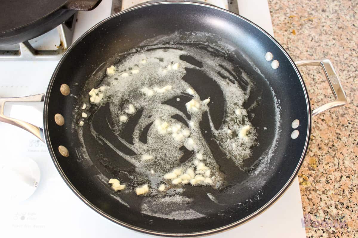Garlic and butter cooking in large skillet.