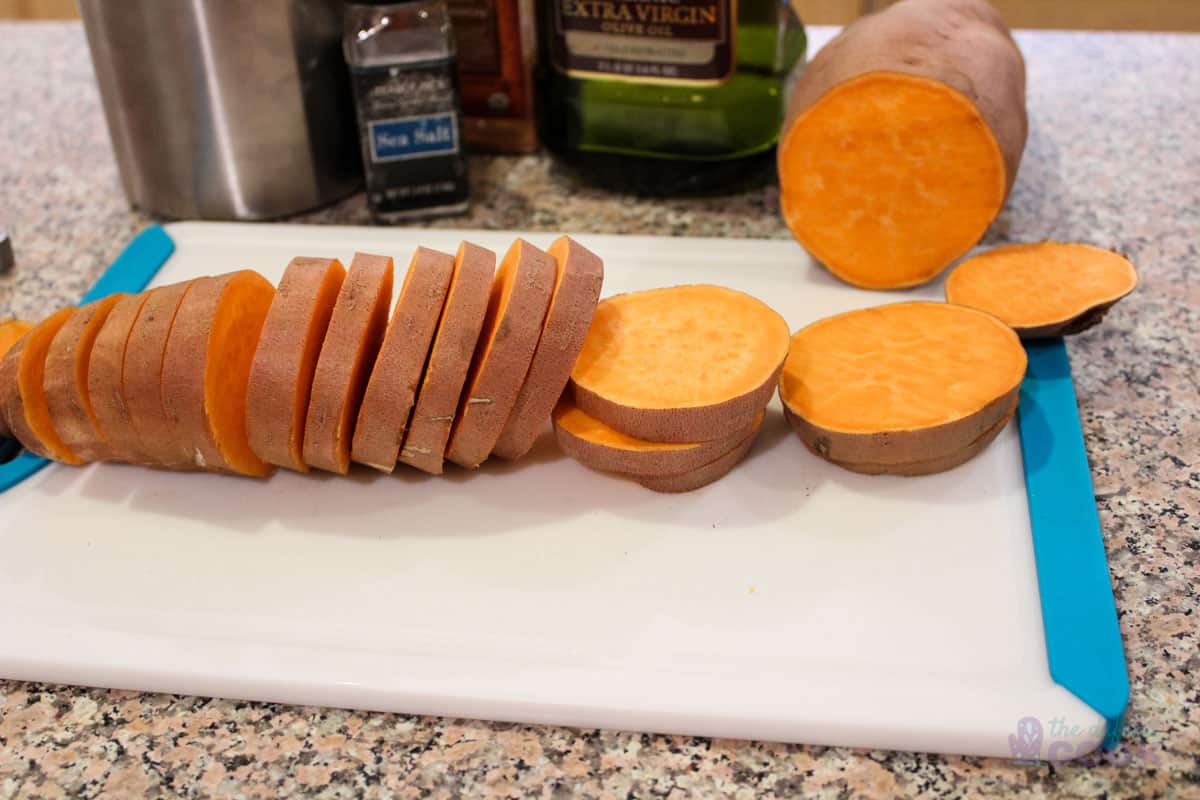 Sliced sweet potato rounds with remaining ingredients in the background.