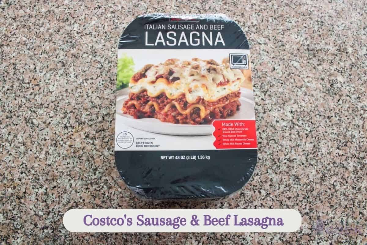Frozen lasagna on kitchen counter in cardboard sleeve.