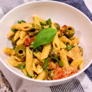 Baked Feta Pasta with penne, tomatoes, olives, feta, and basil.