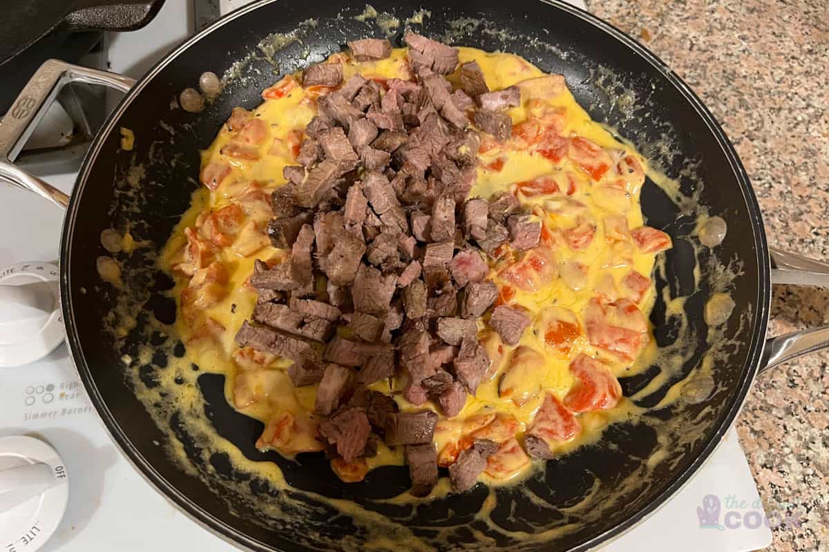 Adding tri tip to skillet.