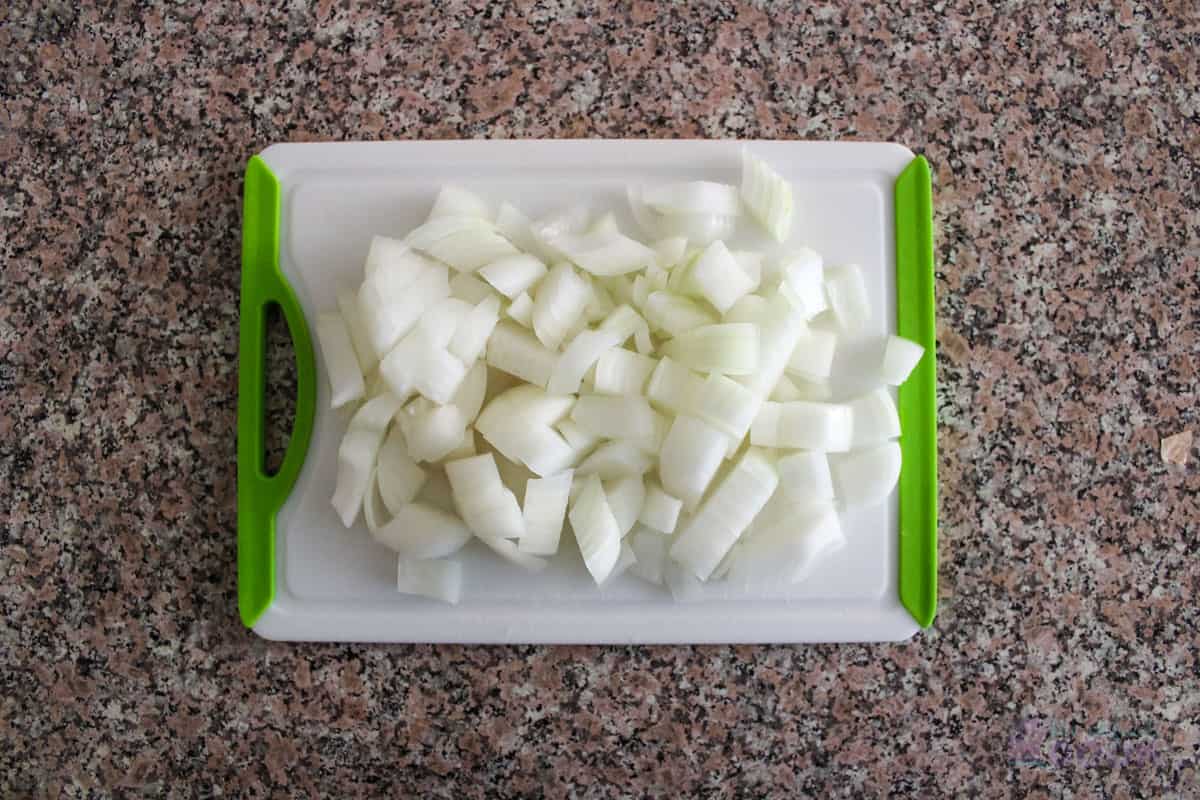 Diced sweet onion on a cutting board.