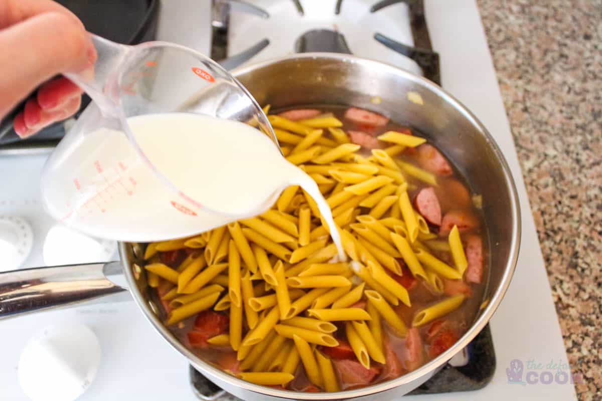 Adding milk and pasta after broth.