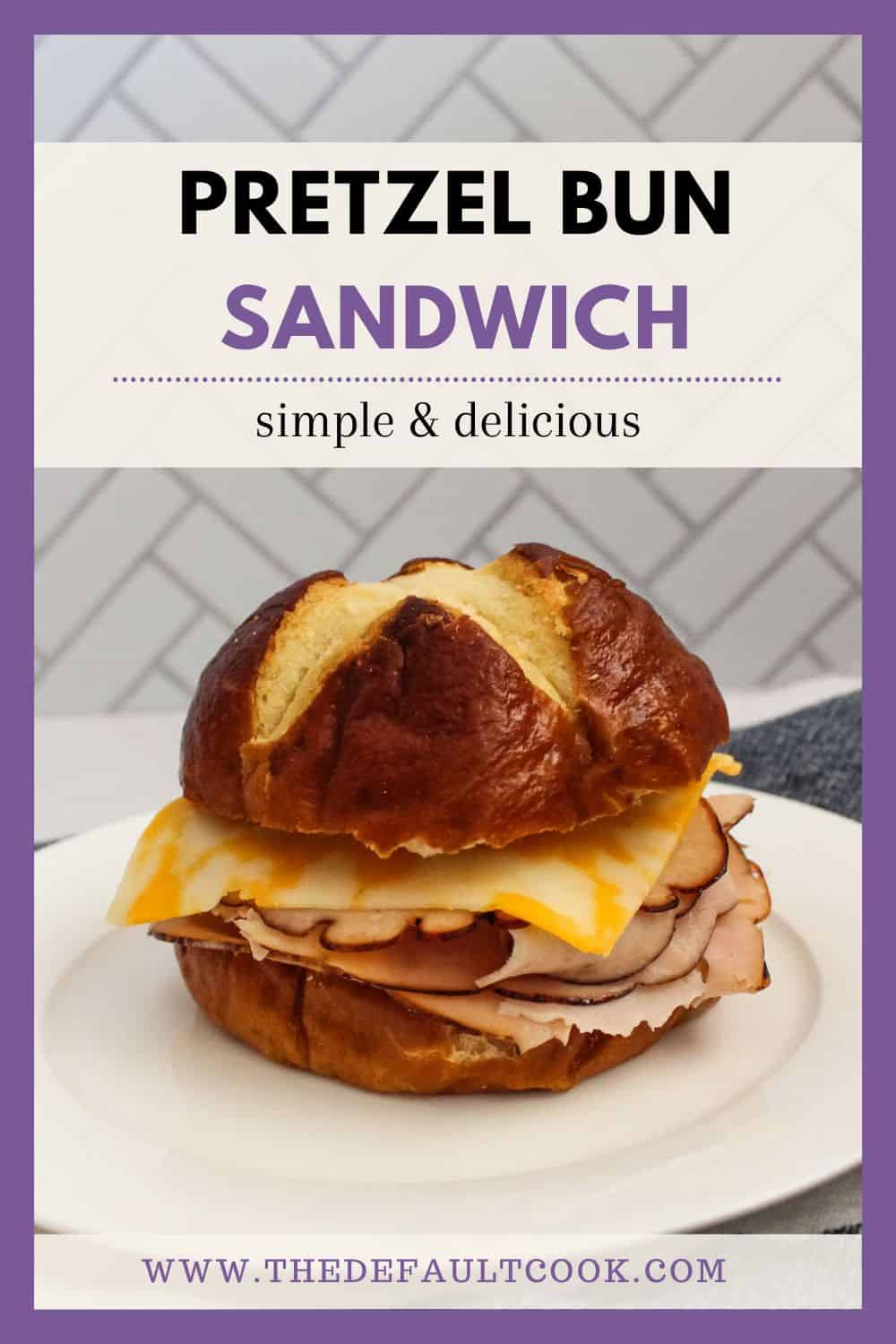 Pretzel bun sandwich on a white plate, with text labeling it above.