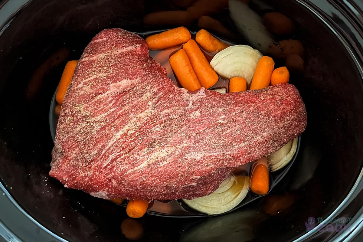 Roast on top of vegetables ready to cook in the slow cooker.