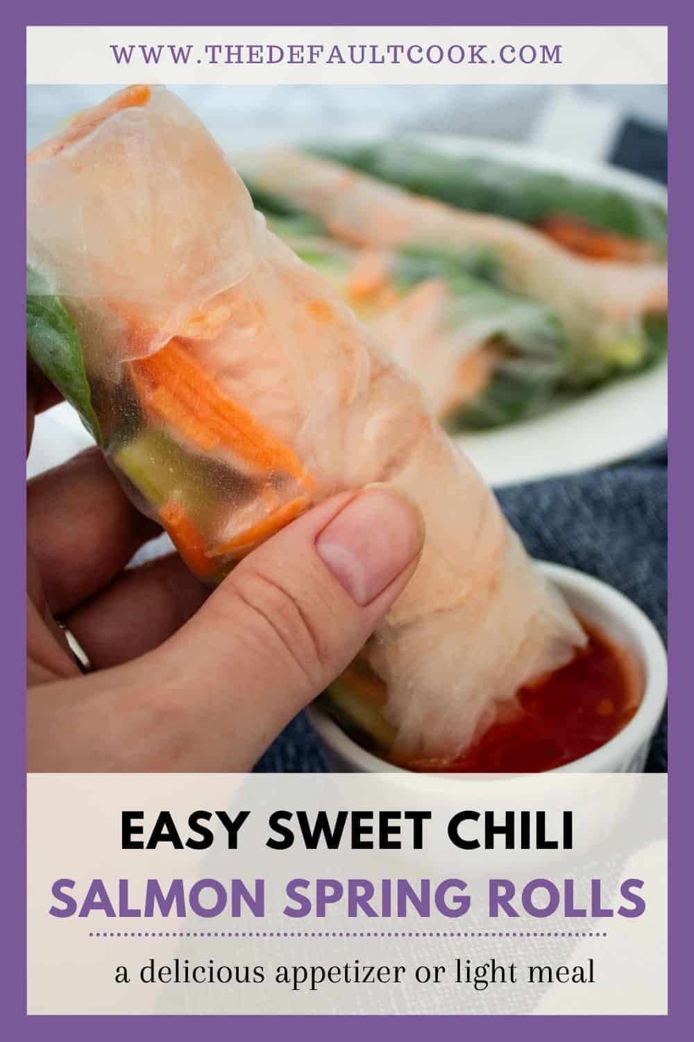 A hand holding a translucent spring roll with visible vegetables and salmon, dipped in sweet chili sauce, with site name above and recipe name below.