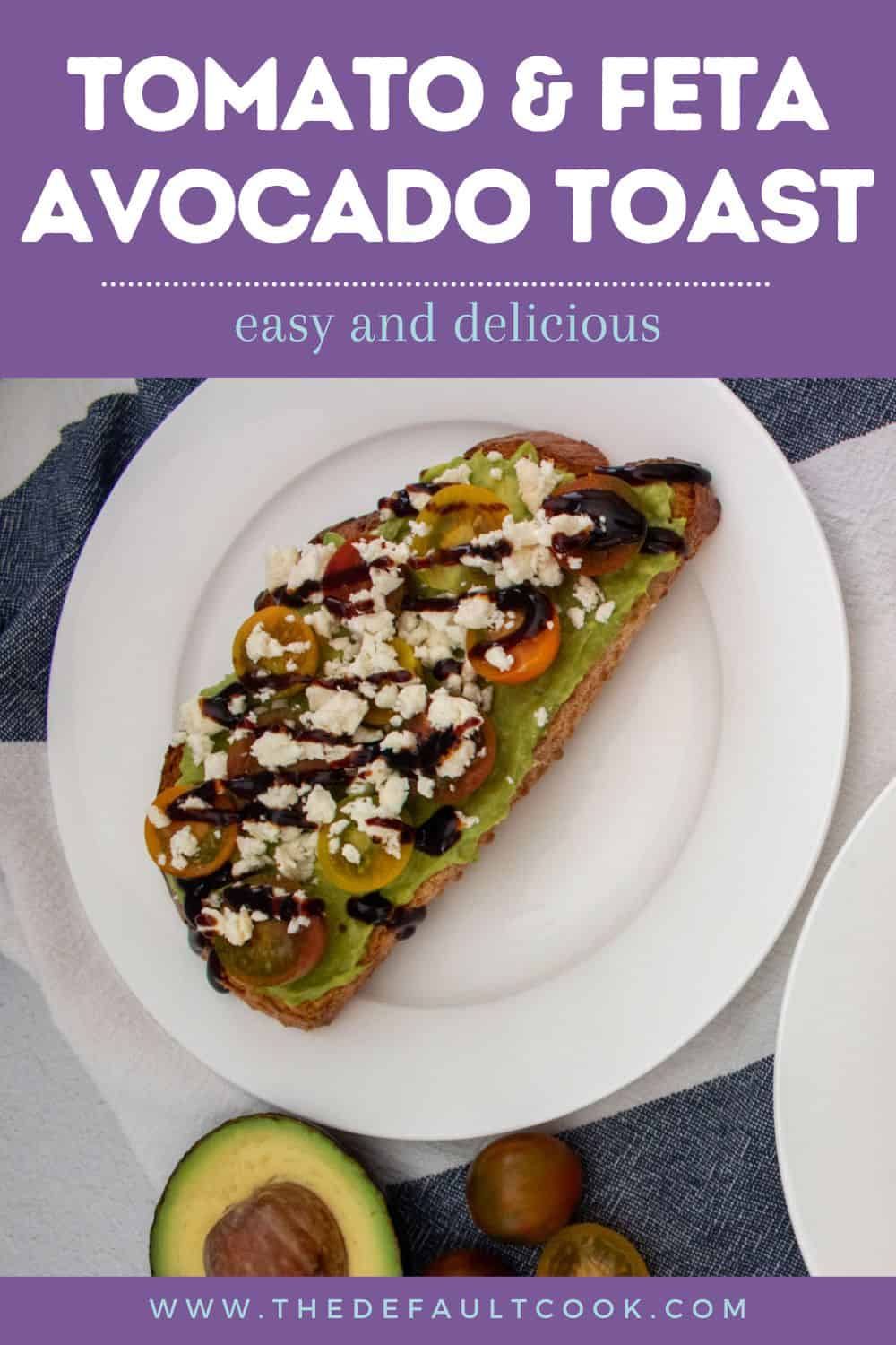 A slice of toast topped with avocado spread, cherry tomatoes, feta, and balsamic drizzle on a white plate, with an avocado half and cherry tomatoes nearby. Text reads Tomato & Feta Avocado Toast.